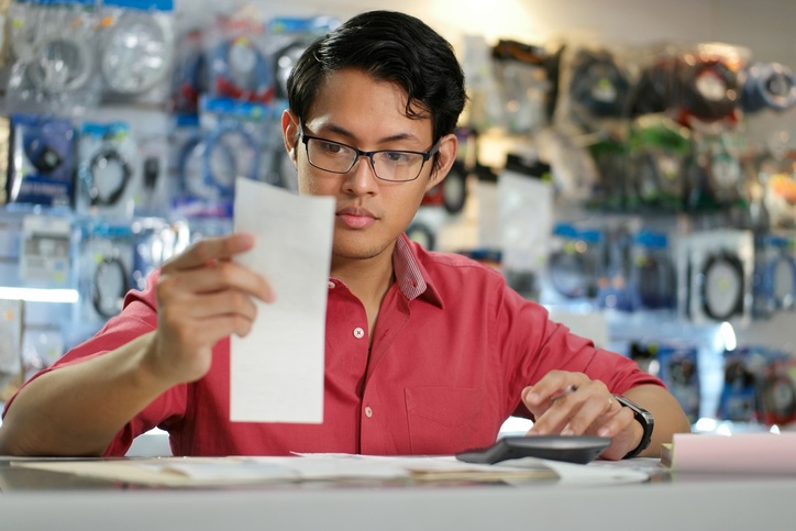 Small Business owner looking at paperwork