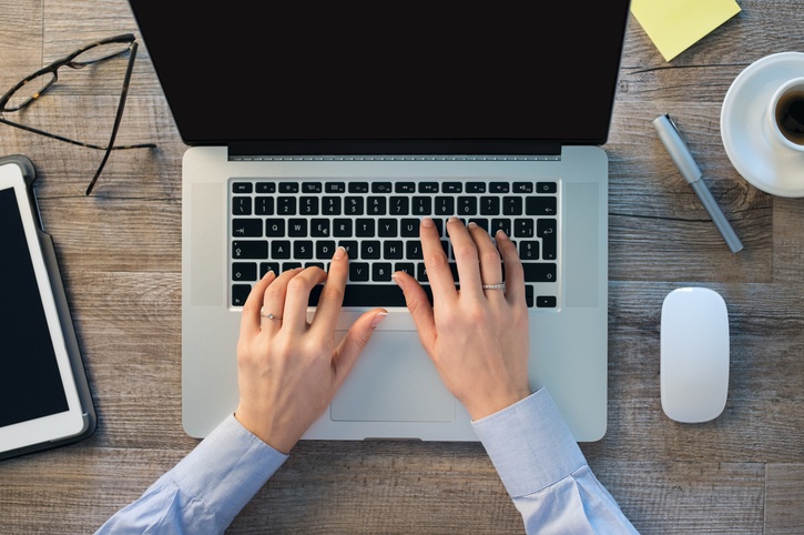 Hands typing on keyboard